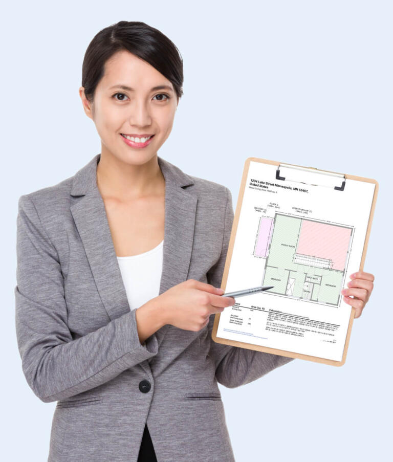 appraiser pointing at the GLA report on her clipboard