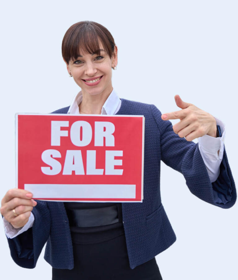 MLS agent pointing at the FOR SALE sign