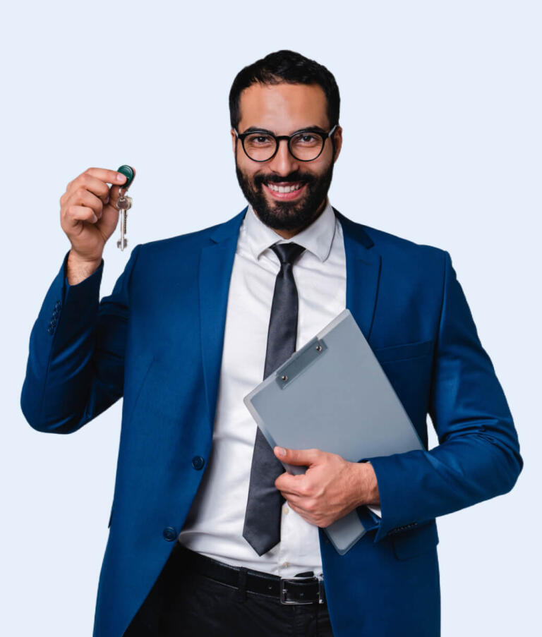 real estate agent holding keys to the new home